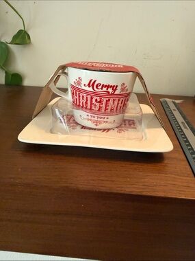 Ciroa porcelain mug and plate set featuring a red and white "Merry Christmas